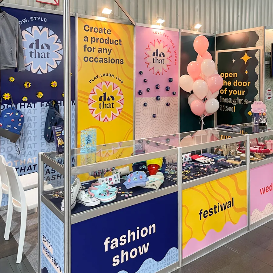 The dothat stand at PROMO SHOW 2023 – the Fashion show and Festival zones with display cases full of gadgets