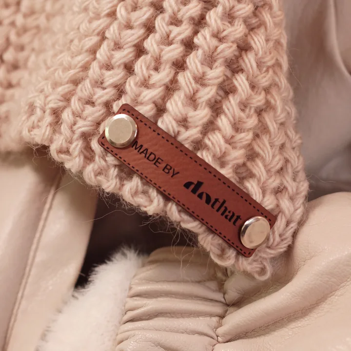 Beige slouchy hat with a chunky-knit scarf, seen from behind
